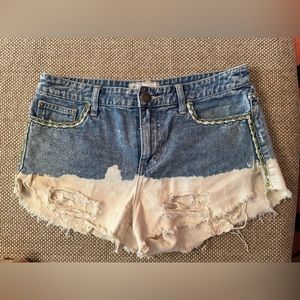 Free People two-tone denim cutoff shorts.